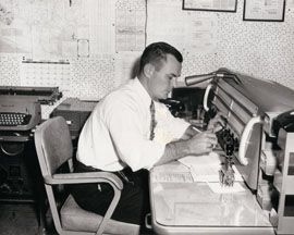 A DPS employee in Corpus Christi listens to a radio dispatch from a trooper out on the roadway in February 1960.