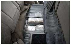 Cocaine concealed in a false compartment in the rear deck of an SUV