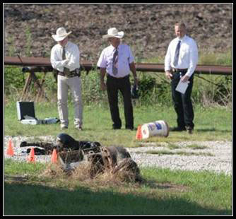 Three Texas Rangers stand outside near cones with numbers