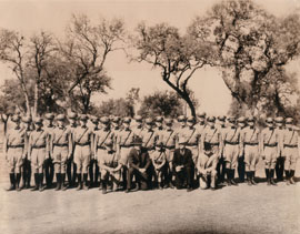 This photo is from 1936 (we think), and it shows the Highway Patrol graduating class from that year. Included are members of the DPS management team as well as a little boy dressed in a miniature Highway Patrol uniform.